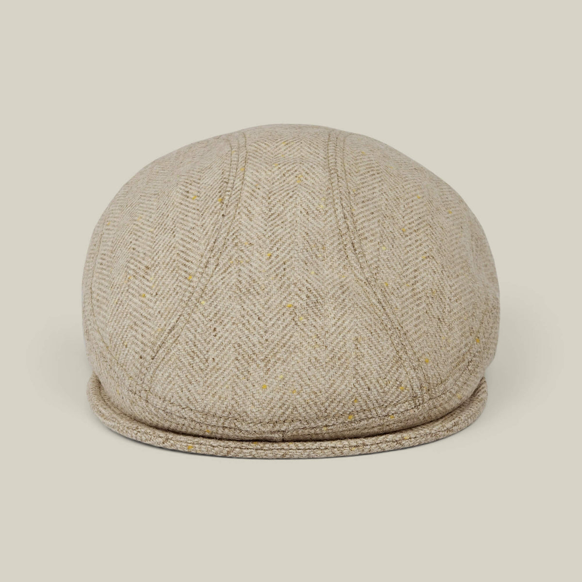 The Goorin Bros. Iris Fields flatcap in Chalk Cream features a herringbone wool design, handmade in the USA, with a beige tweed pattern shown from the front against a plain light background.