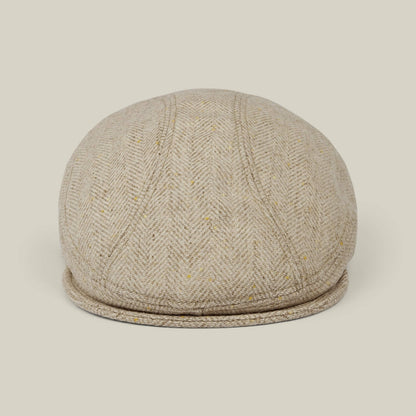 The Goorin Bros. Iris Fields flatcap in Chalk Cream features a herringbone wool design, handmade in the USA, with a beige tweed pattern shown from the front against a plain light background.