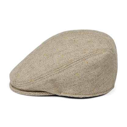 The Iris Fields flatcap by Goorin Bros. features beige cream herringbone wool with a slight peak, handmade in the USA and shown on a white background.