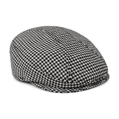 The Norwood flatcap by Goorin Bros., made from 100% wool with a black and white houndstooth pattern, is displayed against a white background.