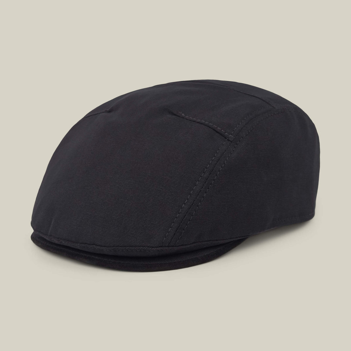 The Goorin Bros. Heatherwood is a dark-colored cotton suede flatcap with visible stitching, shown on a plain, light background.
