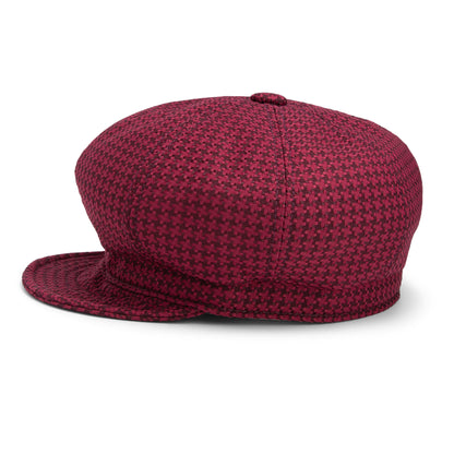 The Goorin Bros. Cold Snap cabbie flatcap, featuring a maroon and black houndstooth pattern, is displayed against a white background to showcase its side and back. Made in America, this hat includes a German wicking sweatband for enhanced comfort.