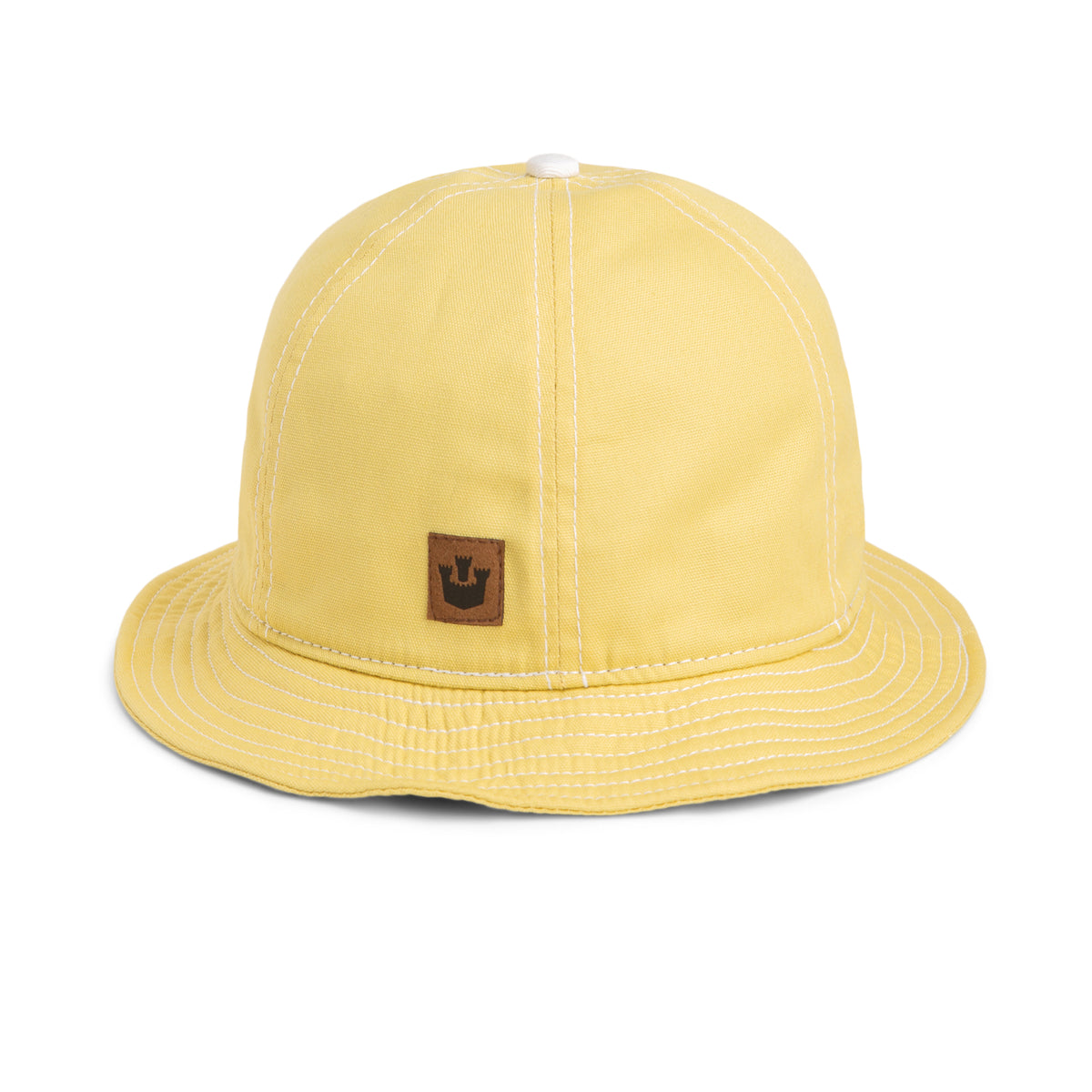 The O. Saka by Goorin Bros. is a yellow Japanese cotton bucket hat featuring white stitching and a small brown patch with a crown logo on the front. This stylish summer hat also includes a wicking sweatband to keep you cool and comfortable all day long.