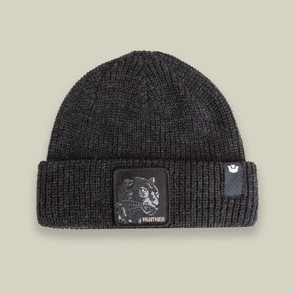 The Panther Beanie by Goorin Bros. in VOID features a folded brim, panther patch, and PANTHER text on the front—blending style and comfort for all seasons.
