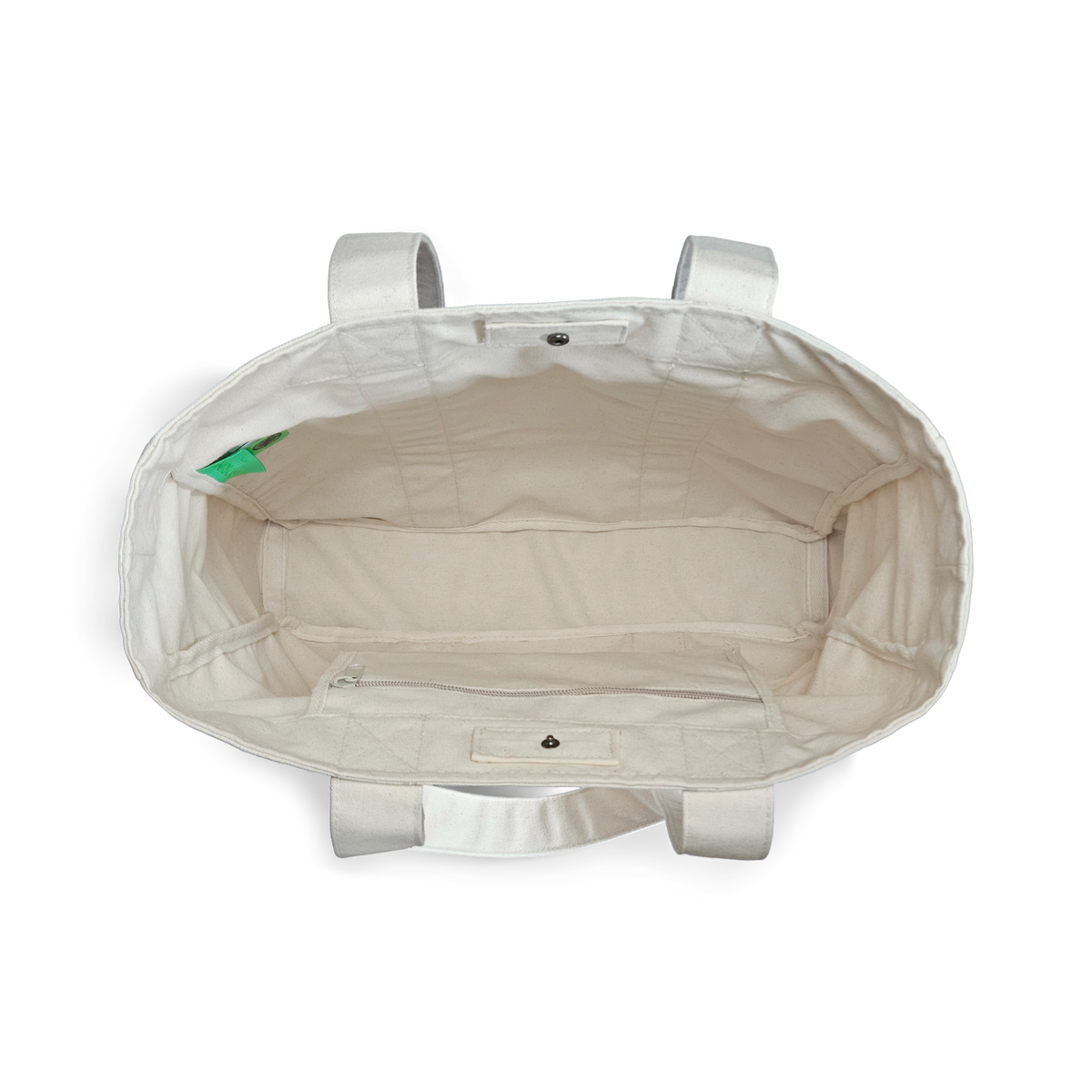 Top view of the Goorin Reworked Tote by Goorin Bros., made in the USA with two handles, a small inner pocket, and a green side label.