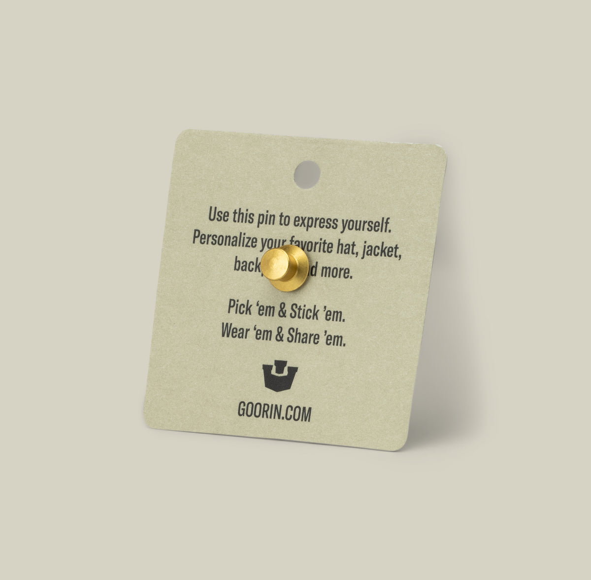 The Cash Cow Trucker Pin by Goorin Bros. is a gold zinc alloy pin on a card with personalization tips. Goorin trucker details and goorin.mom appear at the bottom.