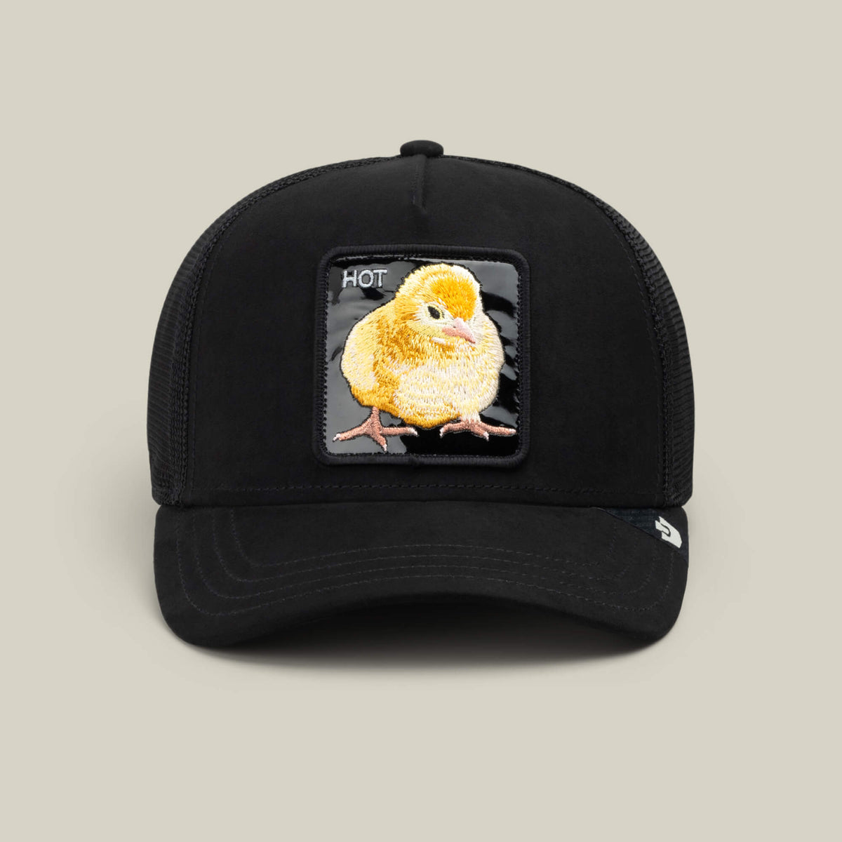 Black Out Chick by Goorin Bros. is a black baseball cap featuring an embroidered yellow chick patch with the word “HOT” in white—an eye-catching, playful addition to your collection.
