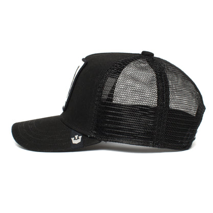 Side view of The Farm’s Little Panther trucker hat for kids, featuring a curved brim, structured front, mesh back for ventilation, and a bold black panther patch.