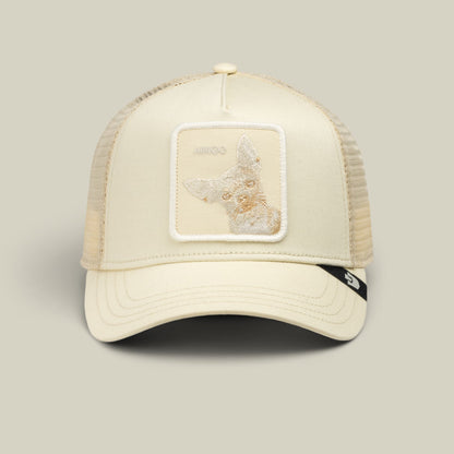 The Goorin Bros. Tonal Amigo Mini is a cream-colored trucker hat with a mesh back and embroidered fox patch on the front panel, displayed against a neutral background.