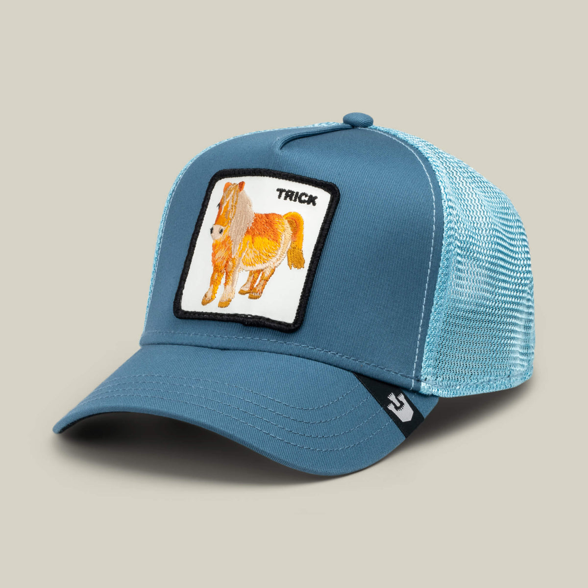 The Goorin Bros. "Dad and Pony Show (Kids)" is a blue mesh trucker hat with a front patch showing a horse illustration and the word TRICK above it.