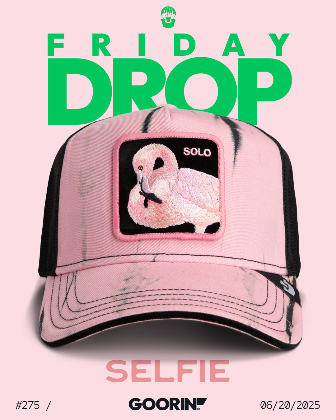 A pink and black Goorin trucker hat featuring a flamingo patch labeled SOLO is displayed with the text FRIDAY DROP, SELFIE, and the date 06/20/2025—showcasing Goorin’s signature durable hats.