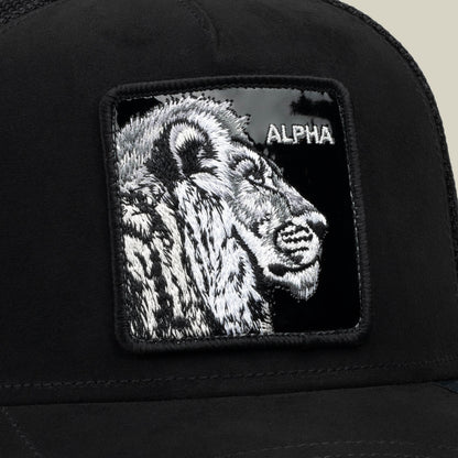 The Black Out Lion hat by Goorin Bros. is a black mesh trucker hat featuring a bold embroidered patch with a lion’s head and the word “ALPHA” in white, combining striking design with classic stealth style.