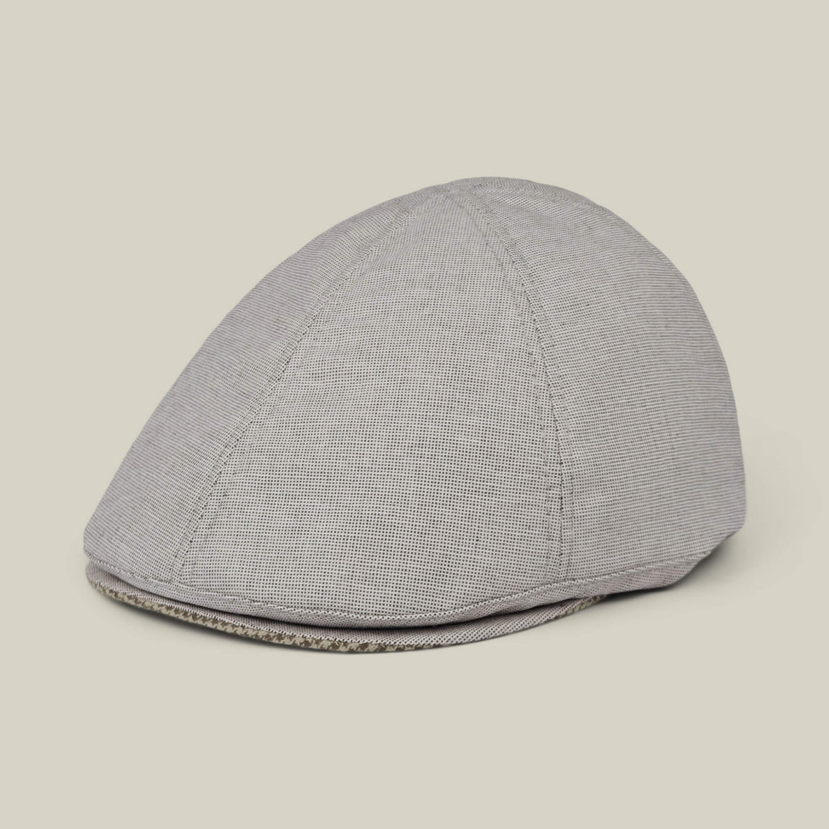 The Mile Rock by Goorin Bros. is a light gray 6-panel Ivy flat cap with subtle texture, hand cut and sewn, shown against a plain off-white background. Made in the USA.