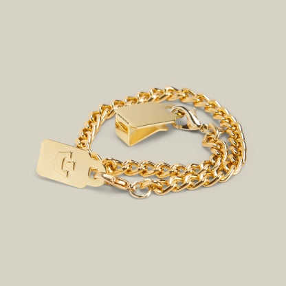 A Goorin Bros. Mini CapLoc Chain gold double clip chain bracelet featuring a rectangular tag engraved with a letter and a geometric clasp, displayed on a neutral background.