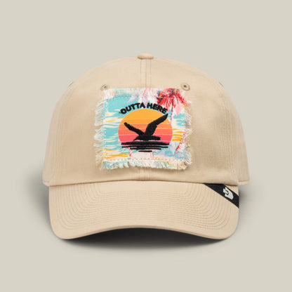 The “GTFO” cap by Goorin Bros. features a beige design with a frayed patch depicting a sunset, palm trees, and the words “Outta Here” above a black bird silhouette—just the thing for channeling those S.O.S. Island vibes, whether you’re off to the mess hall or simply daydreaming about your next adventure.