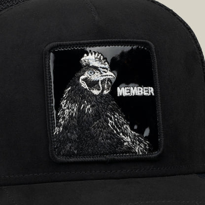 Introducing the Goorin Bros. Black Out Rooster hat, crafted from jet-black polyester and featuring a MEMBER patch adorned with a sewn black rooster and the word “MEMBER” in white on a glossy black background.