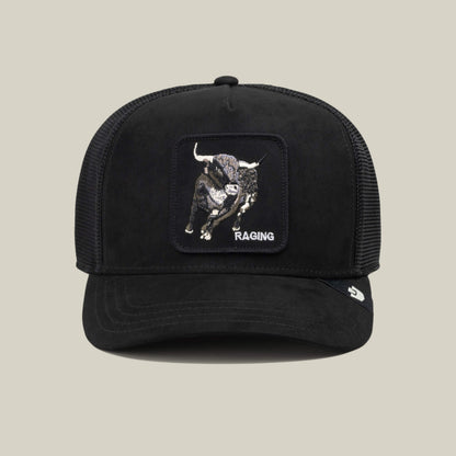 Black mesh trucker hat crafted from durable polyester, featuring a patch with an embroidered Suede Bull and the word “Suede” on the front, displayed on a plain beige background—a bold accessory by Goorin Bros. to complement your athletic wear.