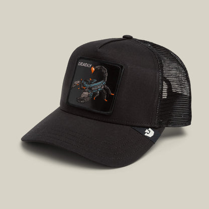The Goorin Bros. Deadly Scorpion trucker hat features a black mesh back, a curved brim, and a front patch showcasing an intricate scorpion insignia with the word “DEADLY” above it. A logo tag decorates the side of the cap.