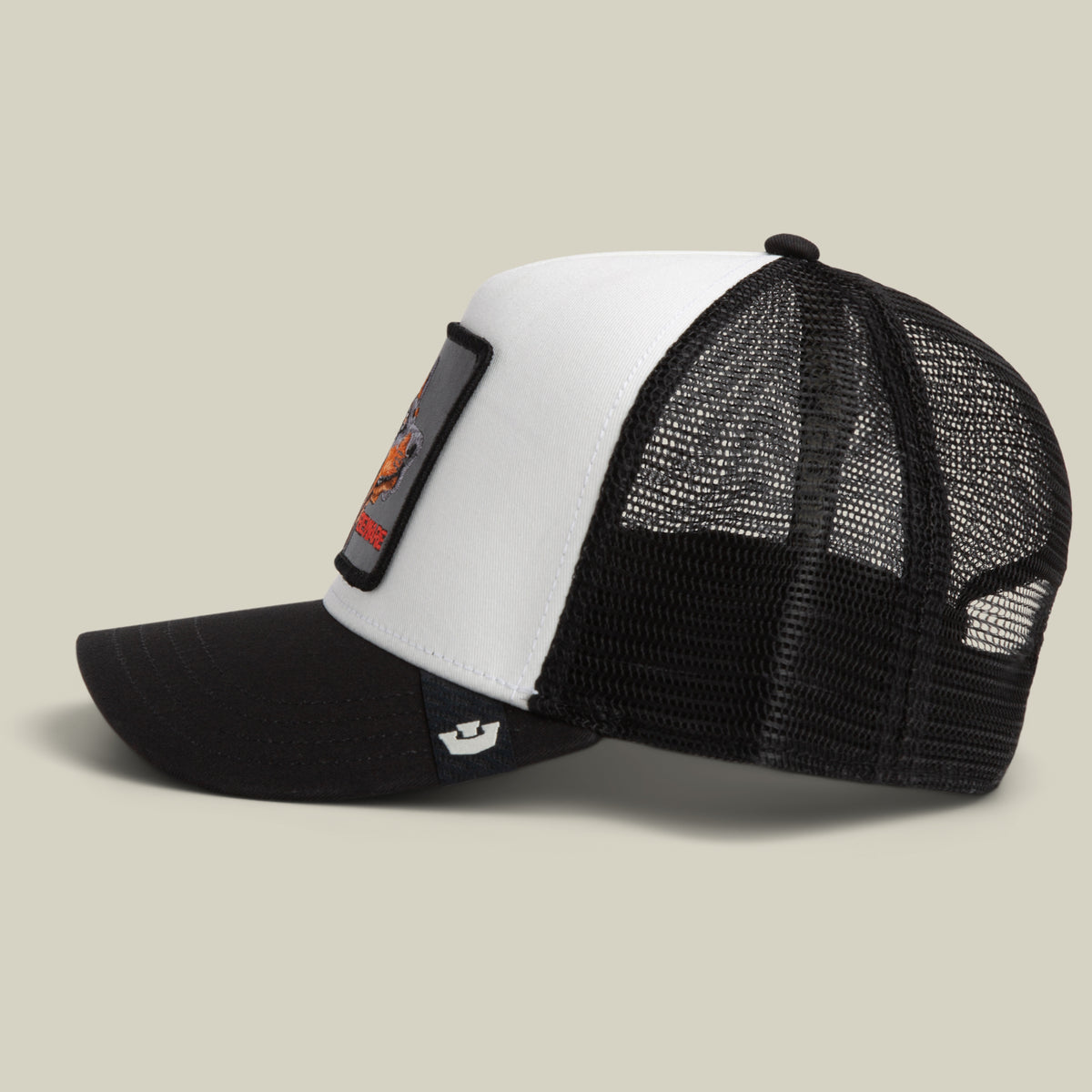 The Beware Dog by Goorin Bros. is a classic trucker hat with a white front panel, black mesh back, curved bill, and a bold rectangular dog patch on the front—perfect for anyone after that stylish beware hat look.
