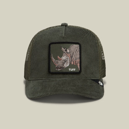 The Goorin Bros. Corduroy Tuff is a dark green trucker hat made from a durable polyester-cotton blend, featuring corduroy fabric on the front, a mesh back, and an embroidered rhinoceros patch with the word “TUFF” on the front.