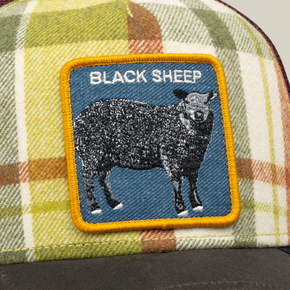 The Brit Sheep by Goorin Bros. is a fall plaid trucker hat featuring a sewn BLACK SHEEP patch, with a black sheep and the words “BLACK SHEEP” in white text above it. Crafted from a classic wool blend, this hat effortlessly adds character to any outfit.