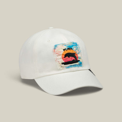 The Goorin Bros. OOO cap is a white baseball hat featuring a rectangular distressed patch with a bear silhouette and sunset design, topped with the word “PEAK.” This stylish Papa Cap Fit is perfect for personal beach maintenance or adding a laid-back touch to any outfit.