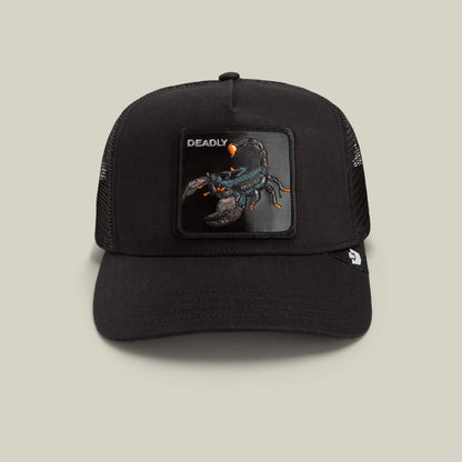 Goorin Bros. Deadly Scorpion black mesh trucker hat with a beige front patch featuring an embroidered scorpion and the word “DEADLY.”.