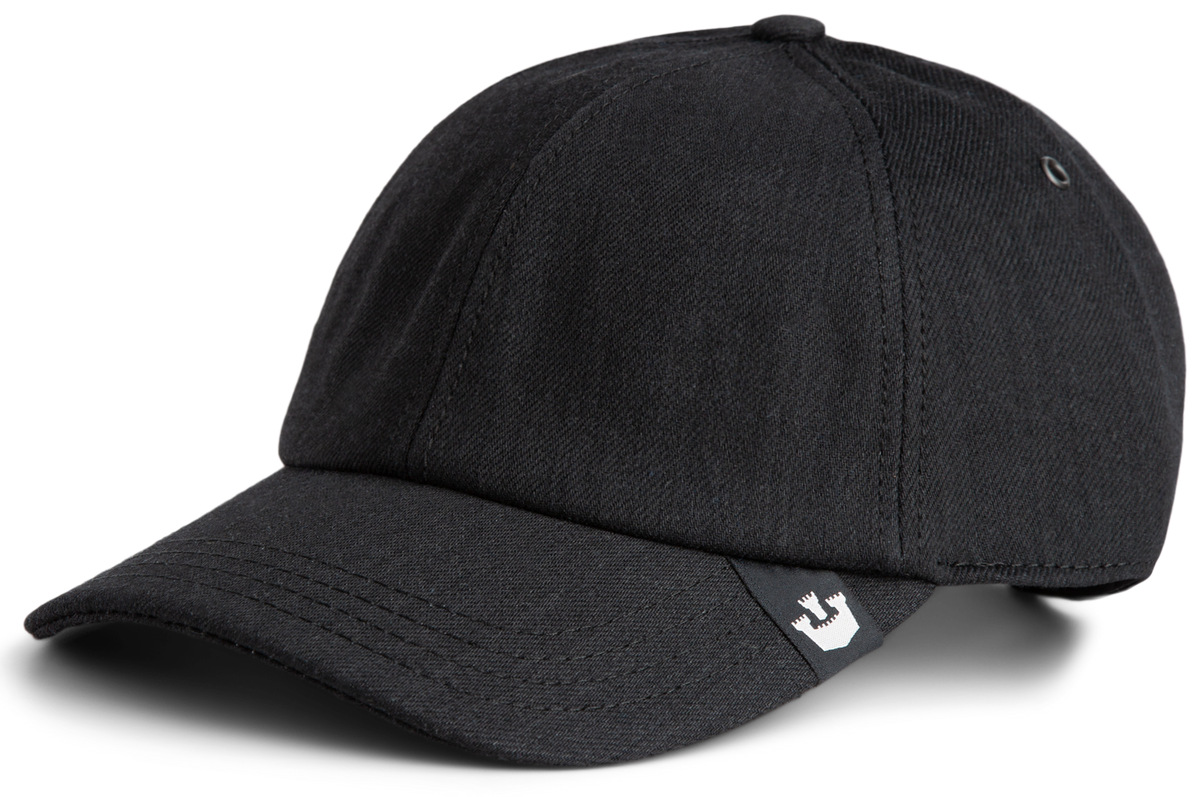 A black baseball cap with visible stitching and a small white logo tag on the brim, perfect for those who appreciate durable hats and timeless style.