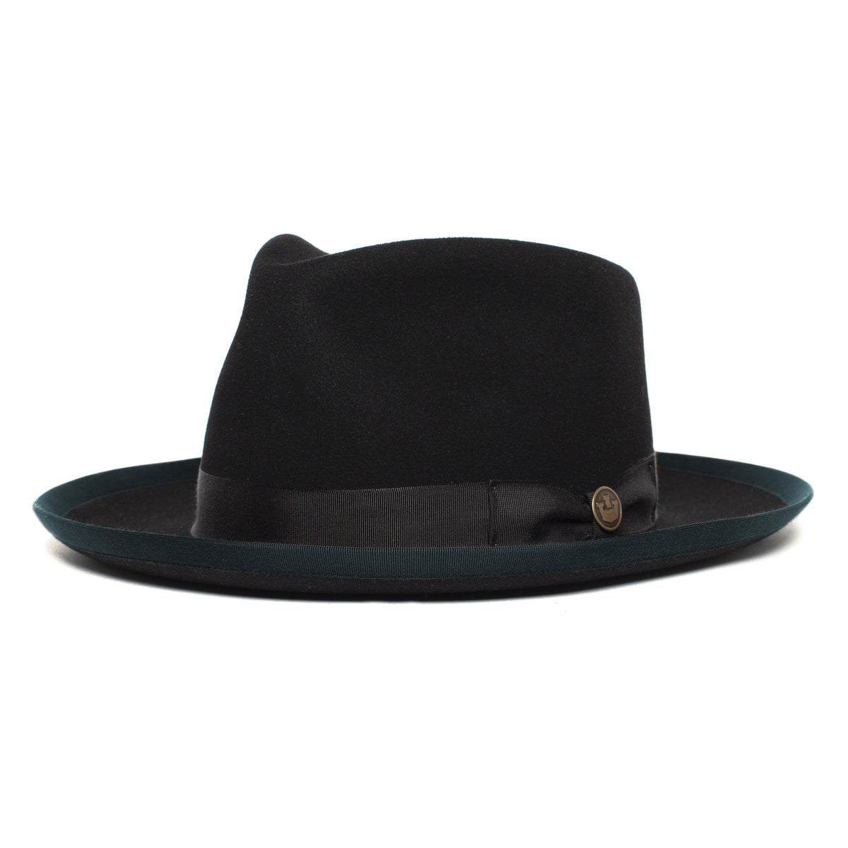 The Goorin Bros. River Gray is a black wide brim fedora hat, crafted from American-made merino wool, featuring a striking dark green brim edge, a sleek black band, and a small round metal emblem on the side, shown on a white background.