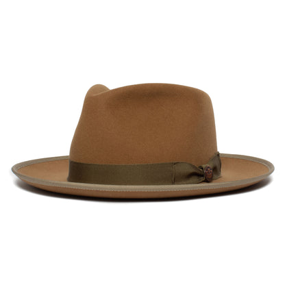 A gray American-made merino wool fedora by Goorin Bros., called the River Gray, featuring a wide brim and a dark olive ribbon band, is shown from the side against a white background.