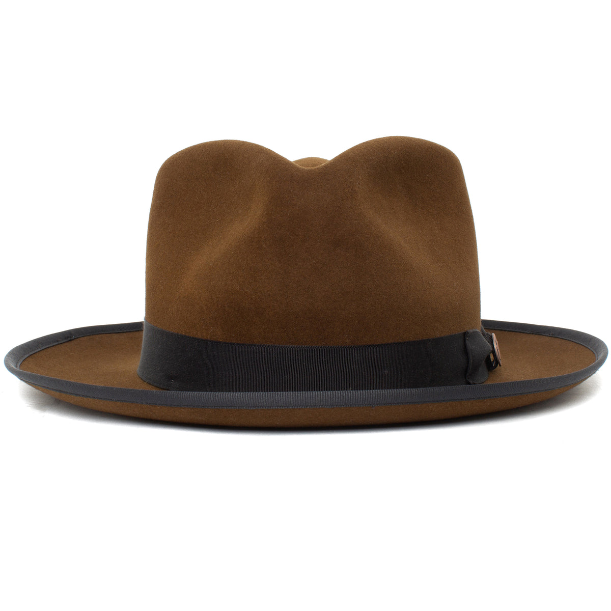 The River Gray by Goorin Bros. is an American-made wide brim fedora crafted from premium merino wool, featuring a black ribbon band and black trim around the edge, shown in brown against a white background.