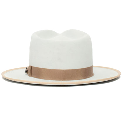 The River Gray by Goorin Bros. is a white Merino wool fedora featuring a wide brim and a beige ribbon band around the crown, expertly crafted for timeless style.