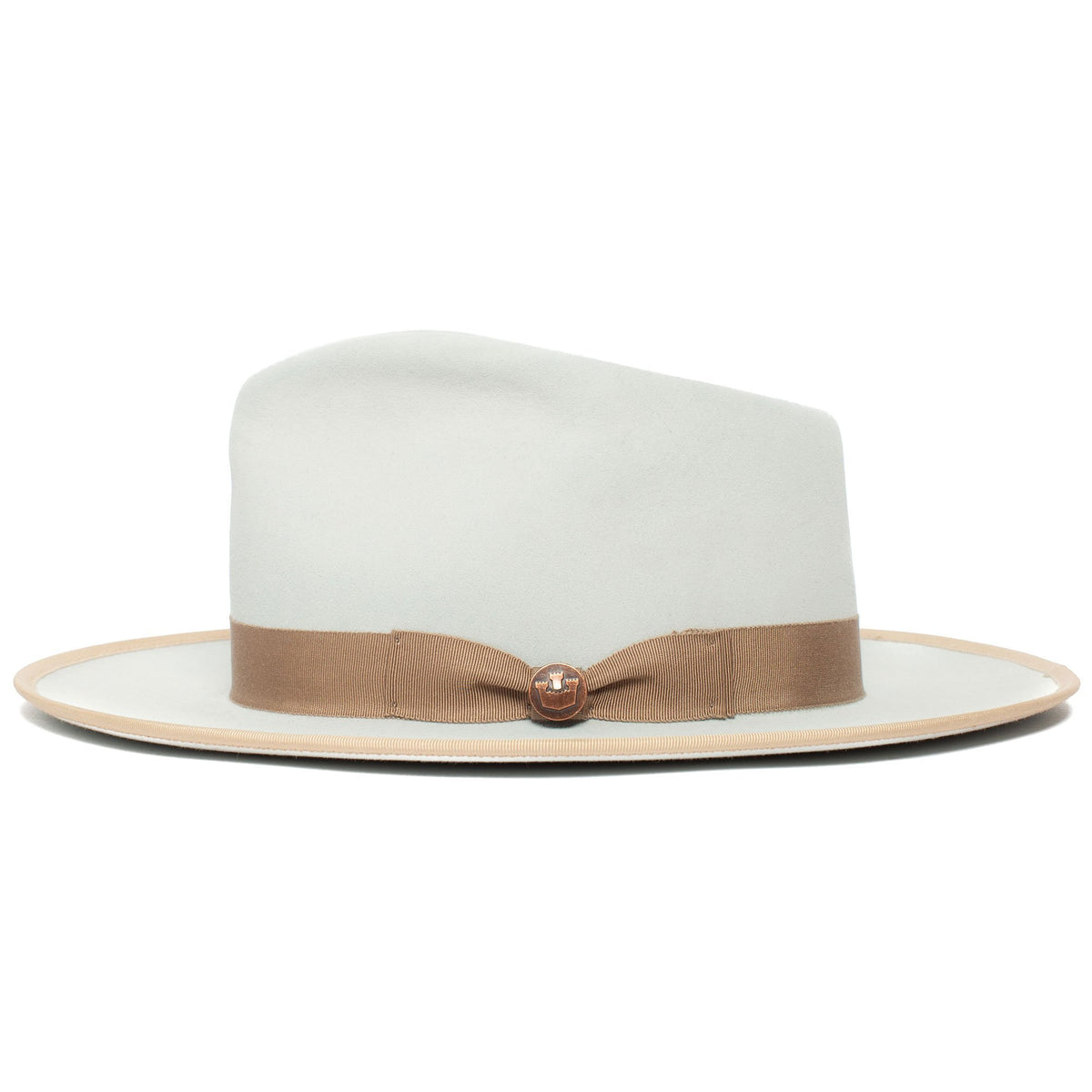 The River Gray by Goorin Bros. is a light gray merino wool fedora with a wide brim, accented by a beige ribbon band and a small round decorative pin on the band, displayed on a white background. Made in America, this wide brim fedora offers timeless style and subtle elegance.
