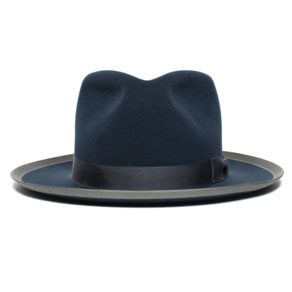 The Goorin Bros. River Gray is a navy blue merino wool fedora featuring a black ribbon band and a slightly wide brim, shown from the front against a white background.