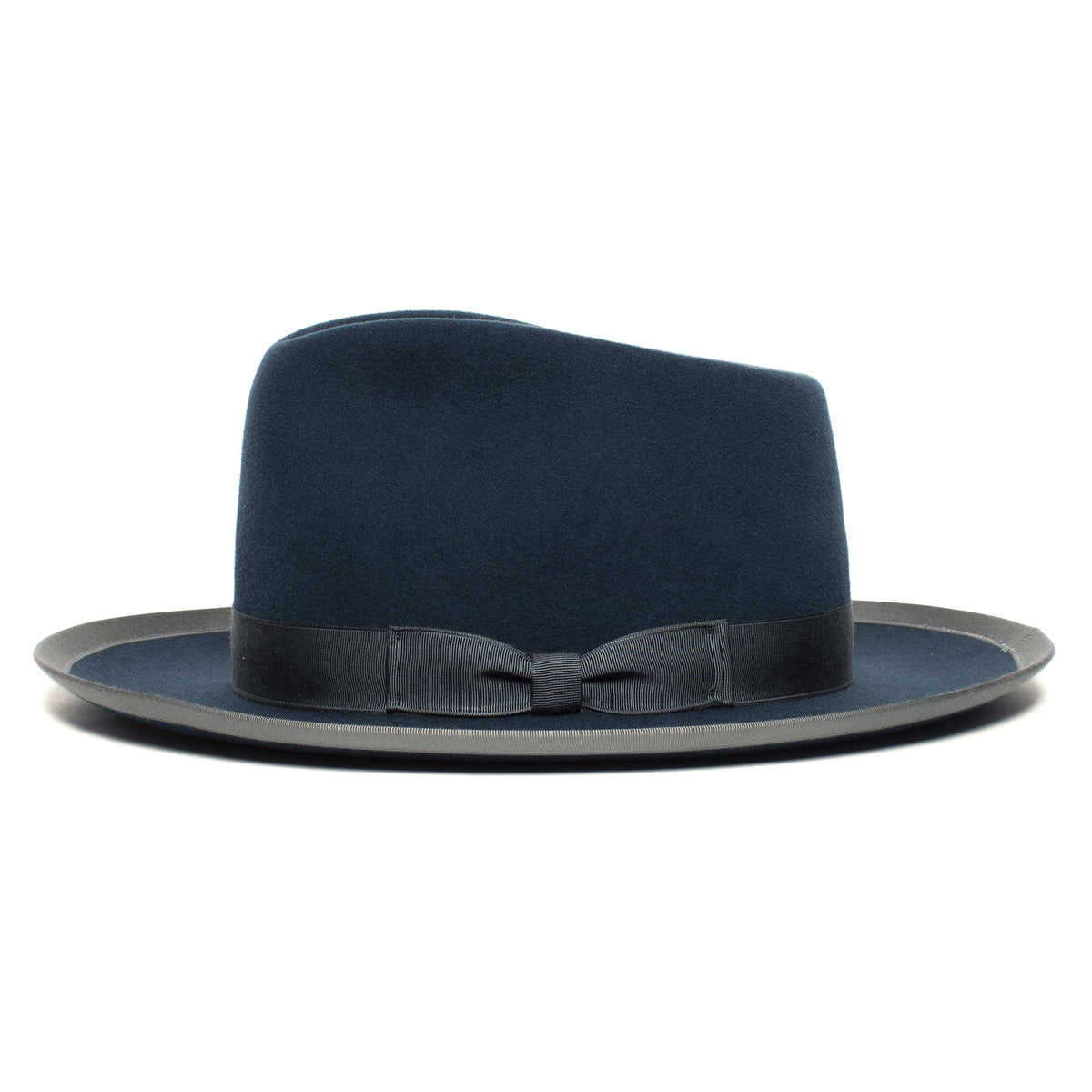 The Goorin Bros. “River Gray” is an American-made wide brim fedora in navy blue, finished with a black ribbon band and small bow, pictured against a plain white background.