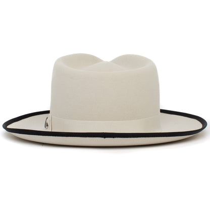 Introducing the River Gray by Goorin Bros.—an American-made fedora hat crafted from premium materials, featuring a cream-colored wide brim, elegant black trim, and a coordinating ribbon band, shown against a white background.