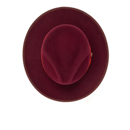 A gray wide-brimmed hat viewed from above, showing its rounded crown and smooth felt texture against a white background—this American-made merino wool fedora, the River Gray by Goorin Bros., exudes timeless elegance and craftsmanship.