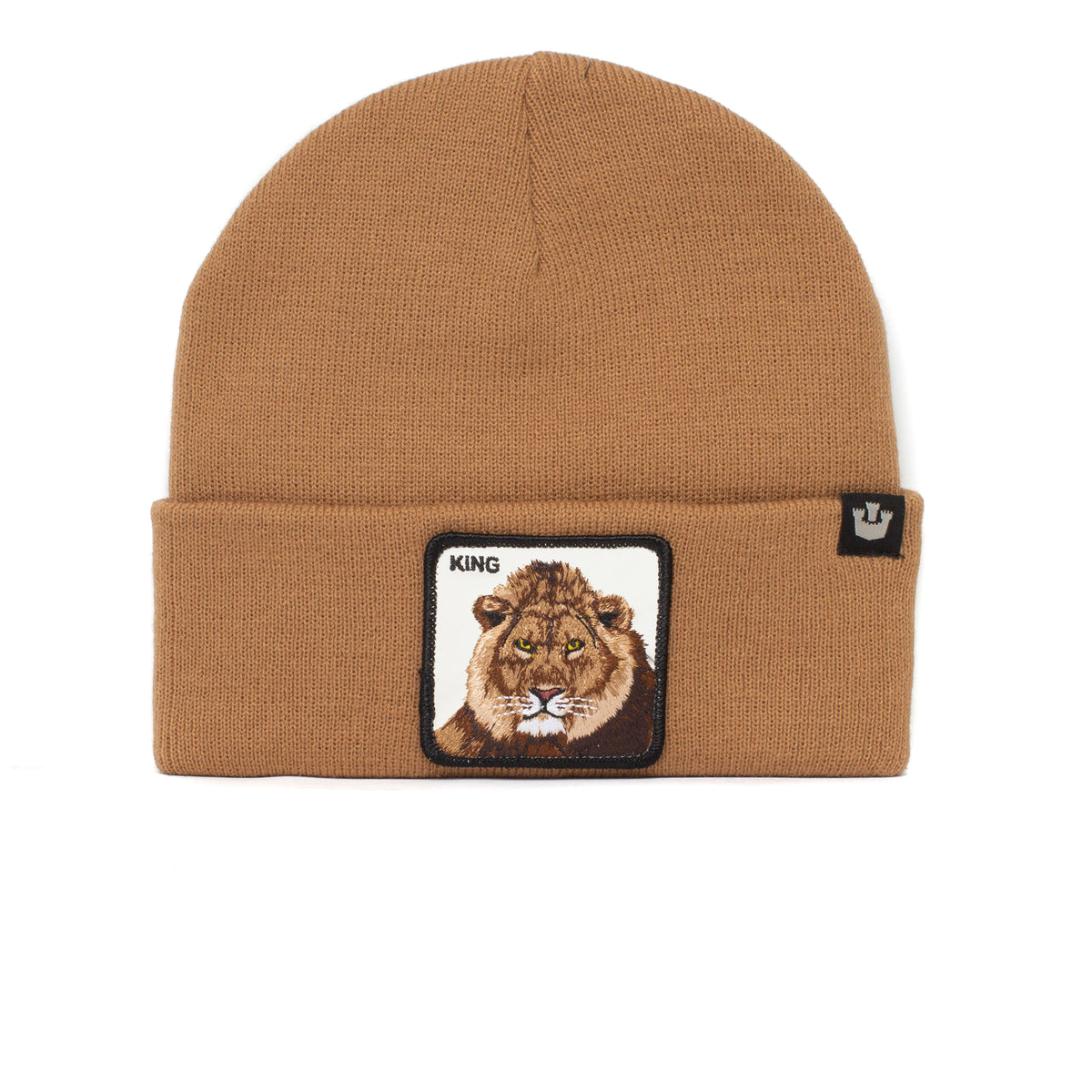 Light Touches by The Farm is a brown knit beanie with a folded brim, featuring a patch with a lion’s face and the word KING on the front. A small black tag is sewn onto the brim for added detail. This cozy beanie is perfect for keeping warm during chilly evenings or bonfires.